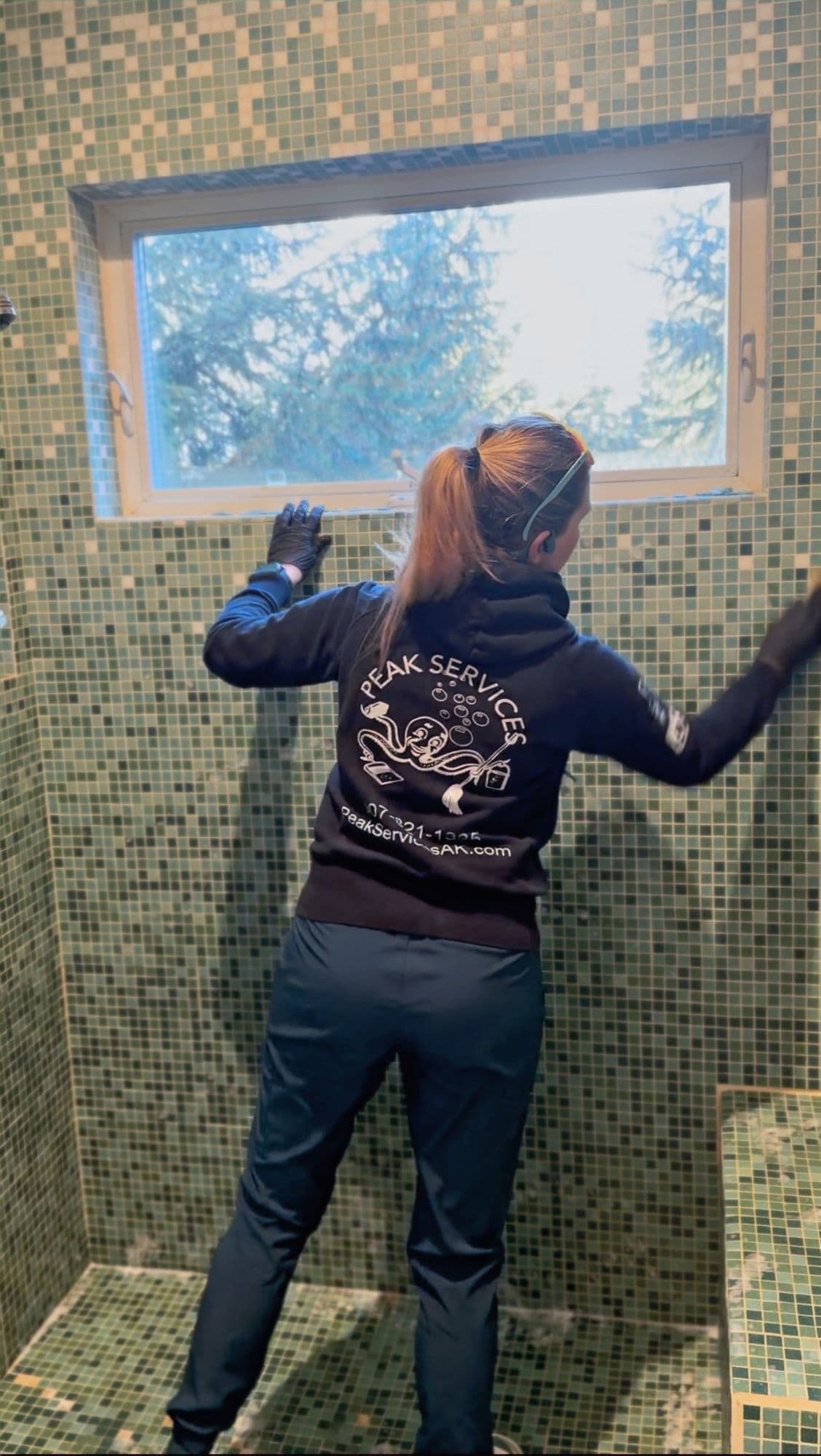 A Peak Services technician checking a property in Southeast Alaska