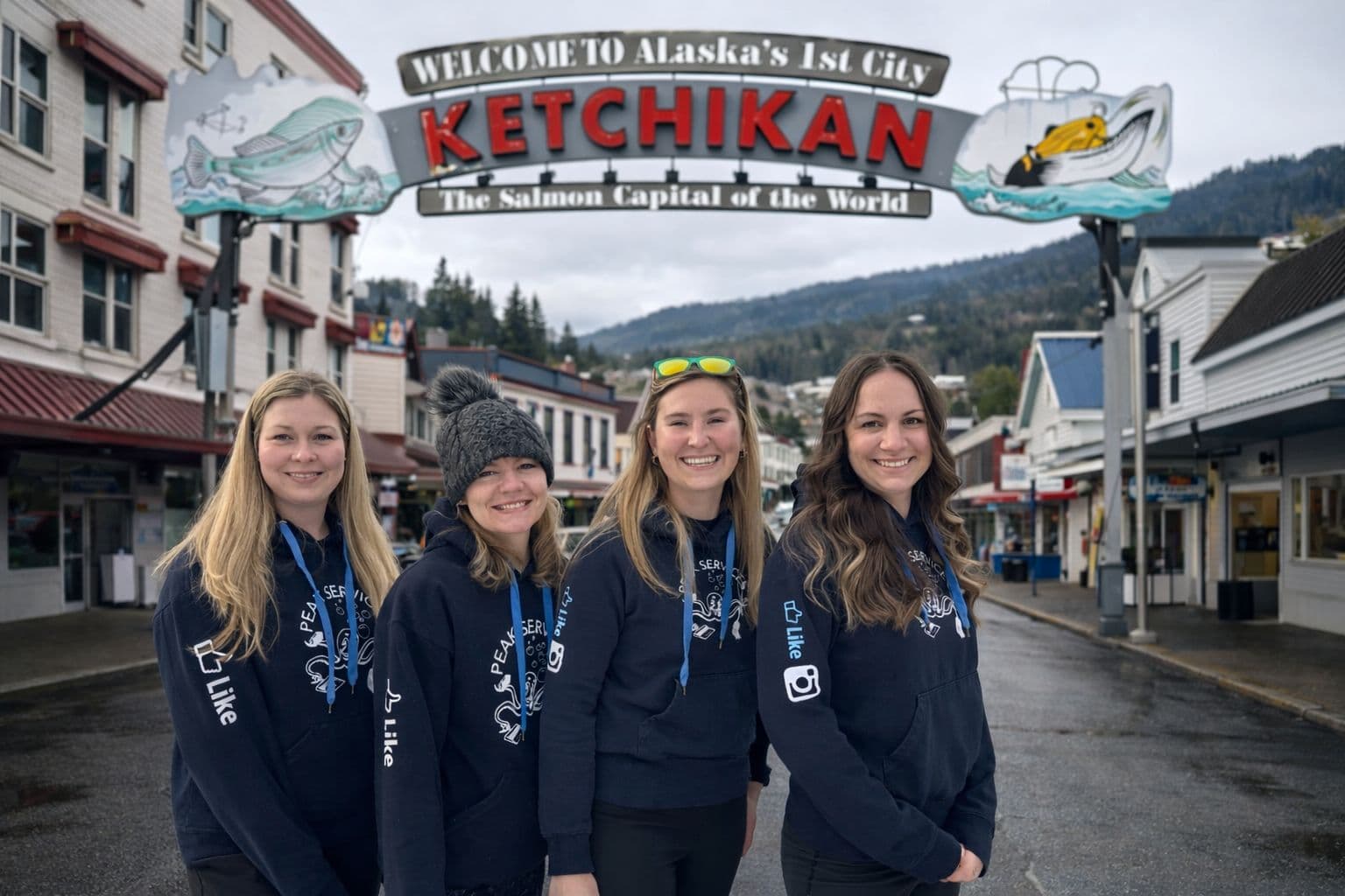 The Peak Services team at the Welcome to Ketchikan sign